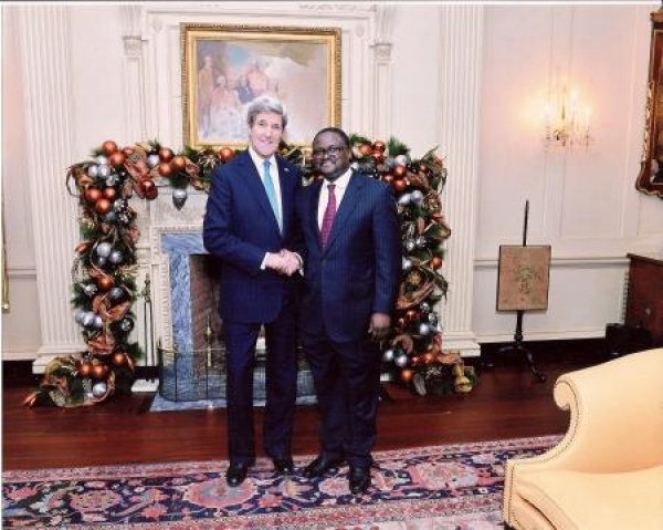 Ambassador Palan Mulonda with Secretary of State, John Kerry at a holiday reception at State Department